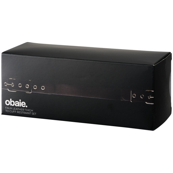 obaie Konstläder Thigh To Cuff Restraint Set Produktförpackning 90